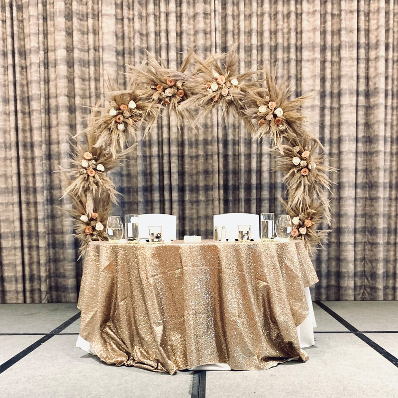 Boho wedding arch fully covered in pampas grass with roses and carnations. Gold glam Indian wedding at Grand Hyatt in Tampa, Florida.