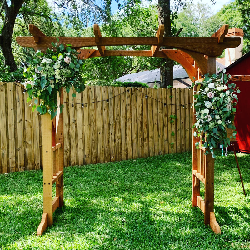 Backyard wedding arch flowers. Lush rustic florals for each side with pink and white garden blooms.